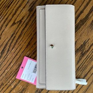 Brand new with tags Kate Spade Mila slim warm beige wallet